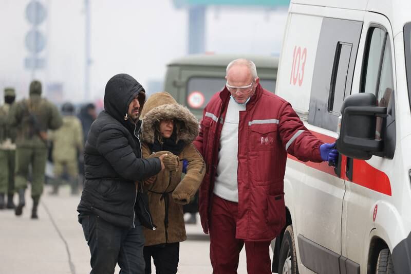 A woman receives medical attention at the Bruzgi-Kuznica border crossing. AFP