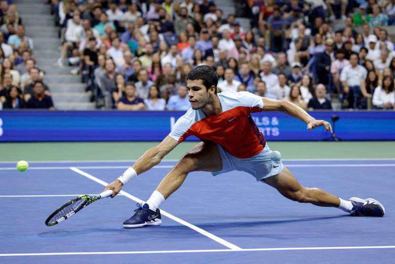 Spain's Carlos Alcaraz hits a return to USA's Frances Tiafoe during their US Open semi-final in New York. AFP