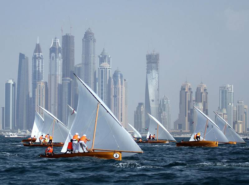 Emirati teenagers sail during the second round of  the Traditional Dhow Sailing Race organized by the Dubai International Marine Club in Mina Seyahi.More than 50 of the 22 foot dhows sailed off the beach of Juemirah Beach Residence.Credit: Kevin J. Larkin/The National