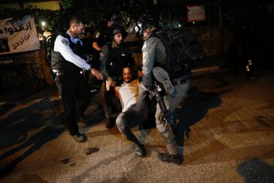 Israeli police arrest a Palestinian demonstrator during a protest in Sheikh Jarrah neighborhood in east Jerusalem. EPA