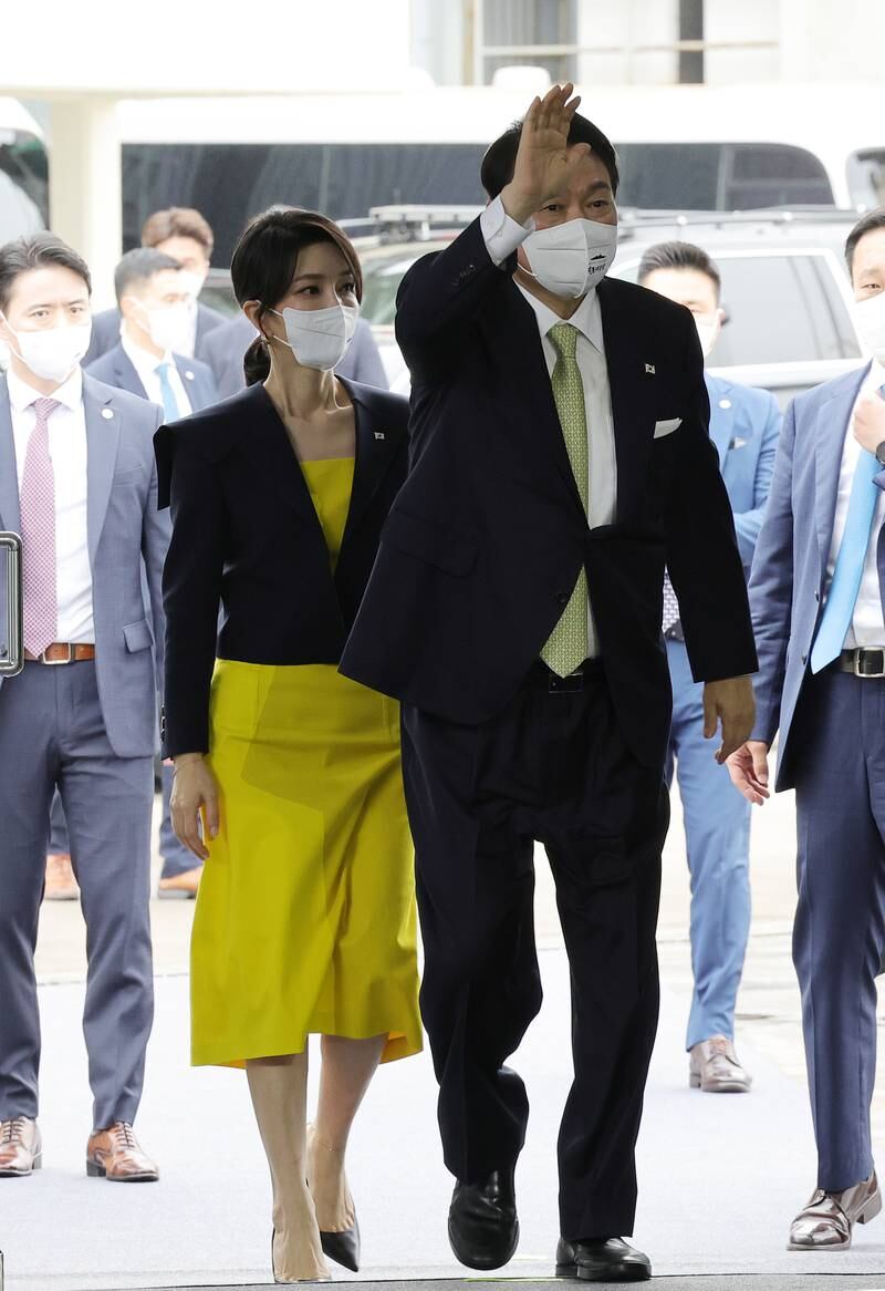 Yoon and Kim arrive at a Hyundai Heavy Industries shipyard to witness the launch a naval destroyer, in July 2022. EPA