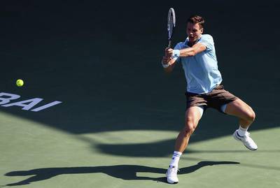 Tomas Berdych plays a shot against Jeremy Chardy during a win in the first round of the Dubai Duty Free Tennis Championships on Tuesday. Francois Nel / Getty Images
