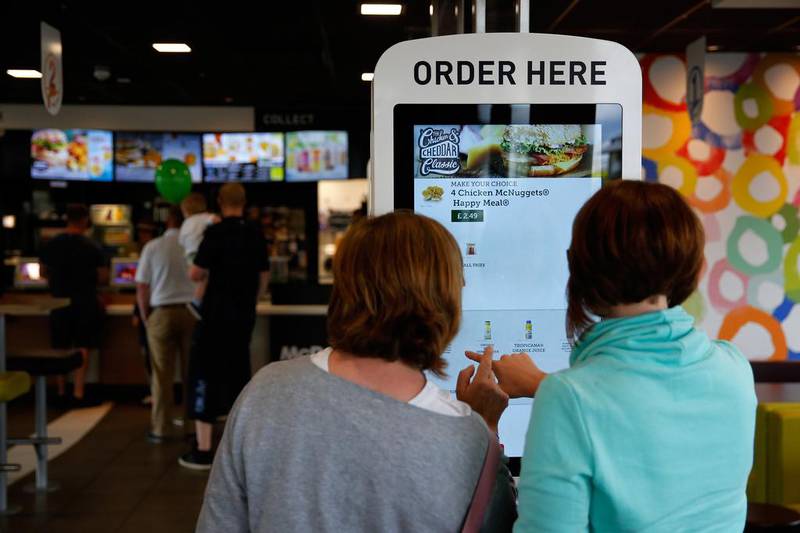 Fingers crossed? Customers use a touchscreen panel to order food at a McDonald’s in Manchester, UK. Paul Thomas / Bloomberg