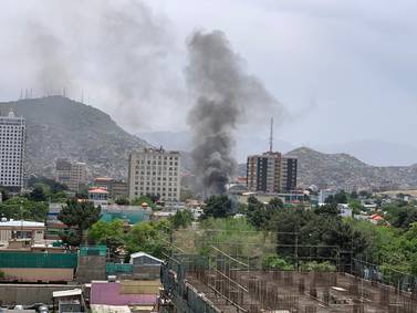 Smoke rises from the site of a car bombing in Kabul. Hikmat Noori and Ruchi Kumar for The National
