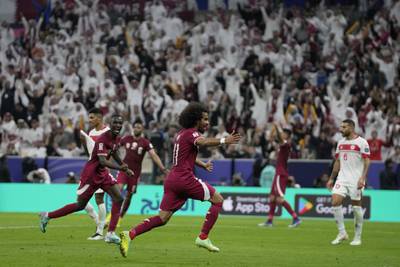 Qatar's Akram Afif celebrates after scoring the opening goal of the Asian Cup against Lebanon at the Lusail Stadium on Friday, January 12, 2024. AP