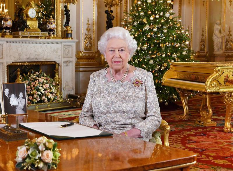 In this photo released on Monday, Dec. 24, 2018, Queen Elizabeth II poses after she recorded her annual Christmas Day message, in the White Drawing Room of Buckingham Palace in central London. (John Stillwell/Pool Photo via AP)