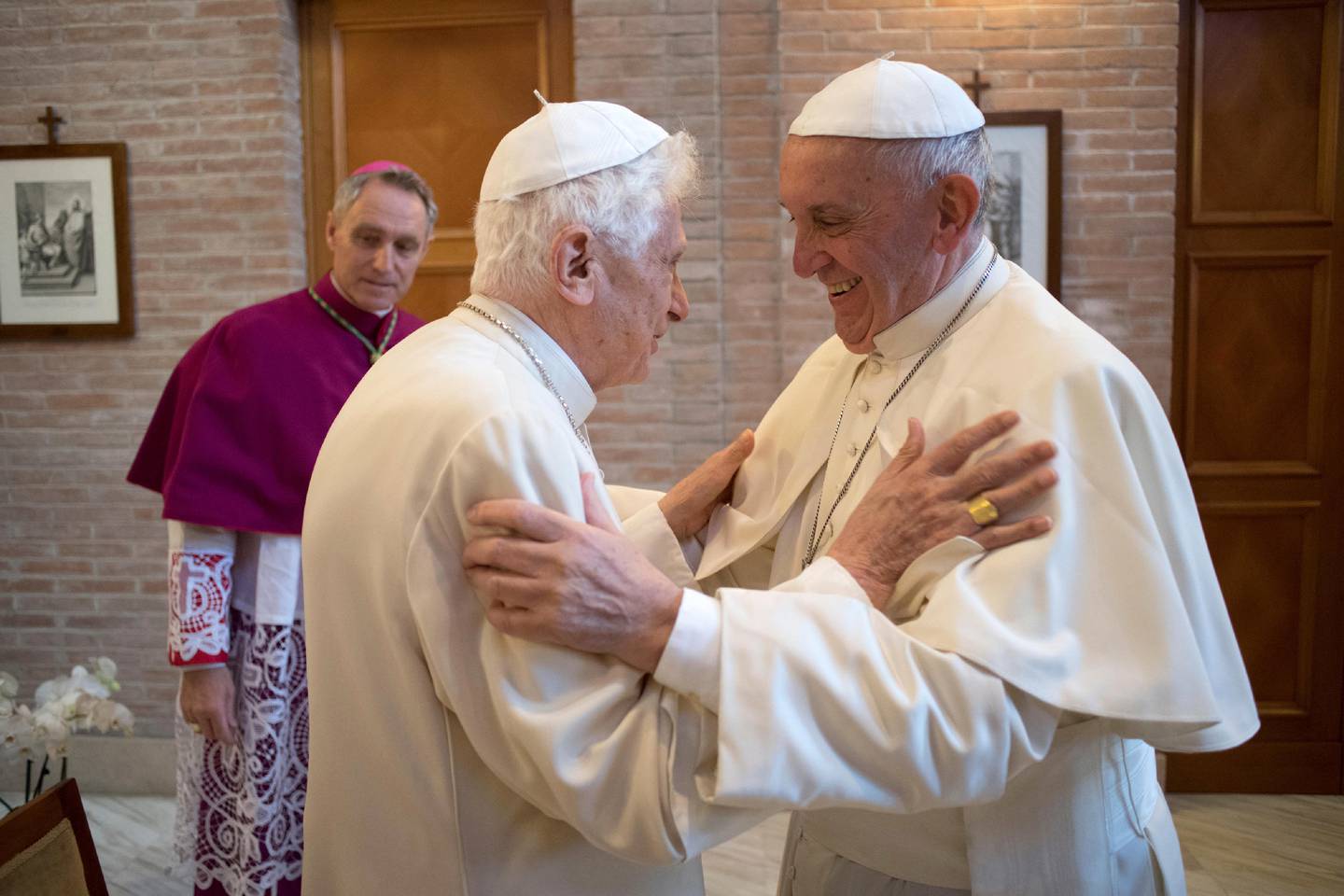 Pope Francis greets Pope Emeritus Benedict XVI in the former Convent Mater Ecclesiae at the Vatican in November 2016. AP
