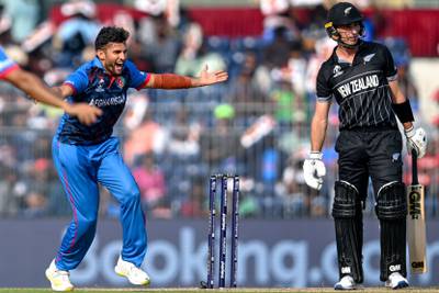 Afghanistan's Azmatullah Omarzai celebrates after taking the wicket of New Zealand's Will Young. AFP
