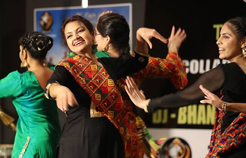 Participants perform Giddha, a popular women's folk dance in the Punjab region.