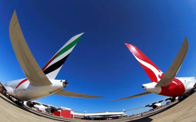 FILE PHOTO - Emirates and Qantas A380 aircraft sit on the tarmac at Kingsford Smith international airport in Sydney September 6, 2012. REUTERS/Daniel Munoz/File Photo