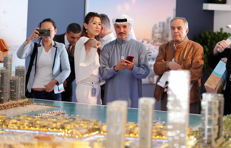 DUBAI , UNITED ARAB EMIRATES , February 26 – 2019 :- Saeed Mohammed Hareb, Secretary General of Dubai Sports Council ( center ) looking at the model of Dubai Harbour at the Dubai International Boat Show held in Dubai. ( Pawan Singh / The National ) For News/Instagram/Big Picture. Story by Nick Webster 