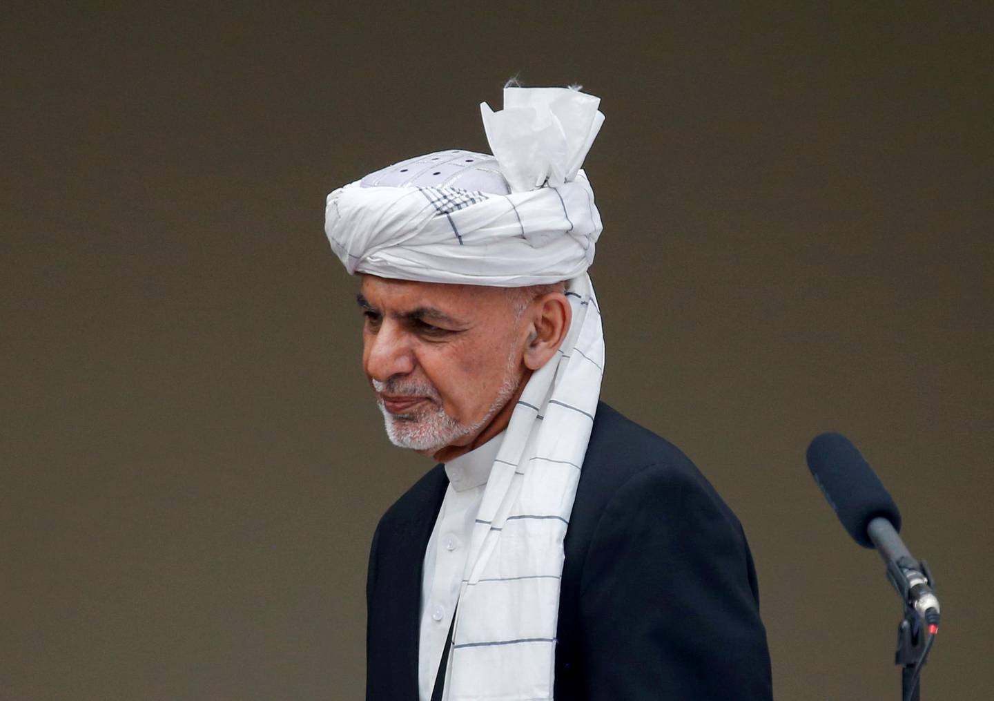 FILE PHOTO: Afghanistan's President Ashraf Ghani arrives at his inauguration as president, in Kabul, Afghanistan March 9, 2020. REUTERS/Mohammad Ismail/File Photo