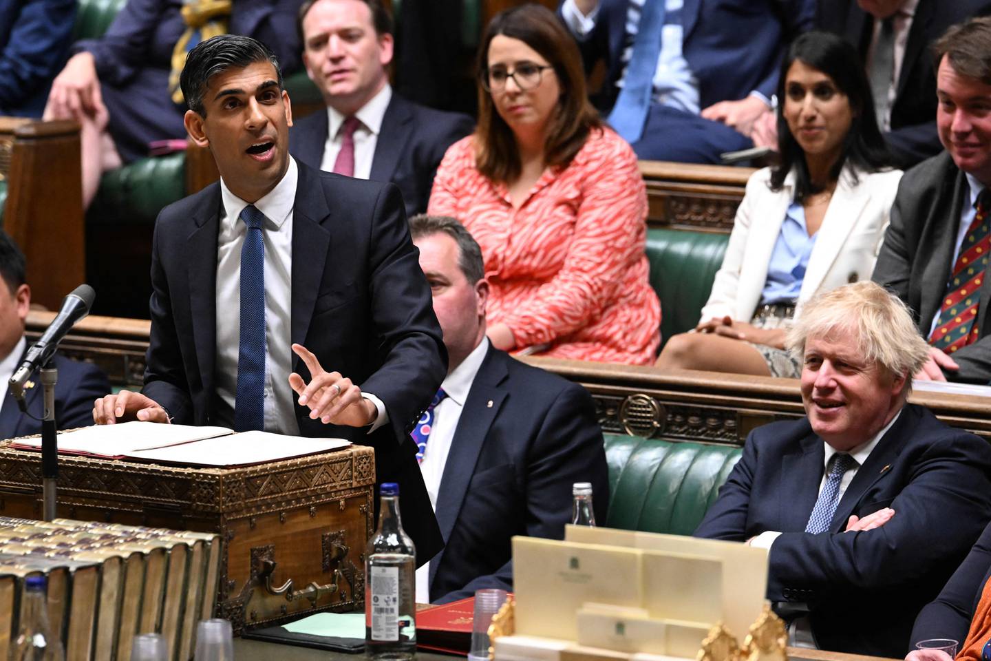 Britain's Chancellor of the Exchequer Rishi Sunak (L) making a statement on the cost of living crisis in the House of Commons on May 26, 2022. AFP