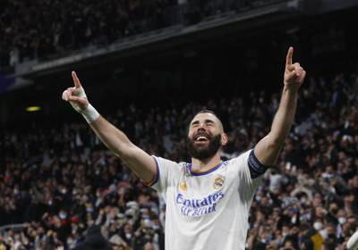 Real Madrid's Karim Benzema celebrates scoring his third goal to secure an incredible 3-1 win against PSG in the Champions League last 16. Reuters