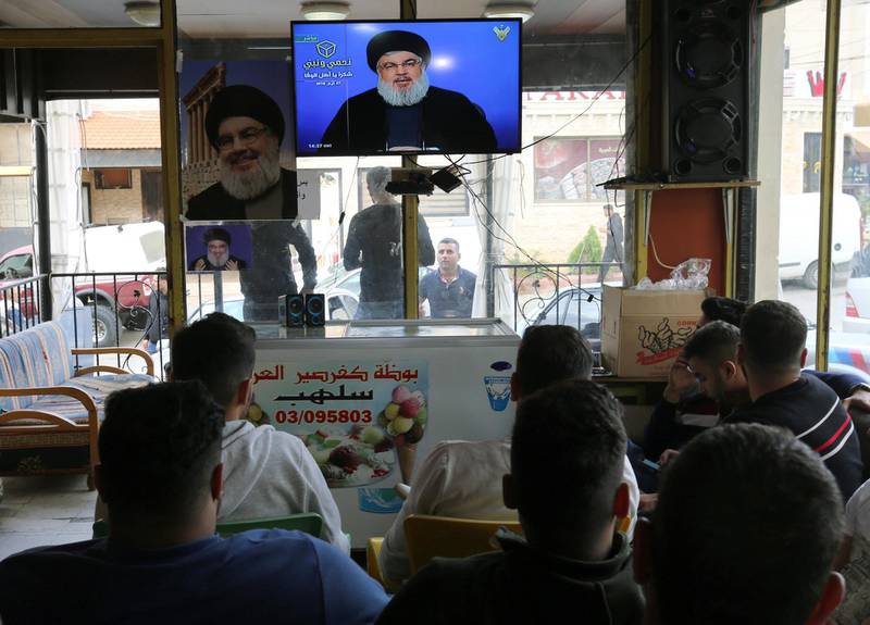 People watch Hezbollah leader Hassan Nasrallah speak on television following the Lebanese elections. Aziz Taher /  Reuters