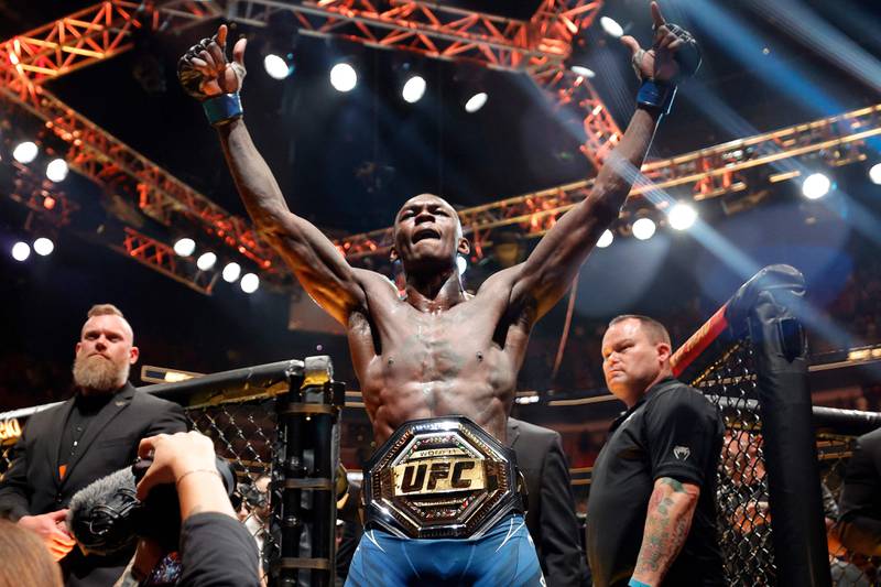 MIAMI, FLORIDA - APRIL 08: Israel Adesanya of Nigeria celebrates after knocking out Alex Pereira of Brazil in round 2 to reclaim the middleweight title during UFC 287 at Kaseya Center on April 08, 2023 in Miami, Florida.    Carmen Mandato / Getty Images / AFP (Photo by Carmen Mandato  /  GETTY IMAGES NORTH AMERICA  /  Getty Images via AFP)
