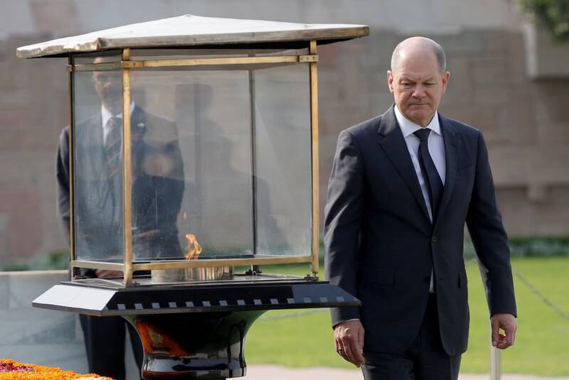 German Chancellor Olaf Scholz arrives to pay homage at the Mahatma Gandhi memorial, in New Delhi. Reuters