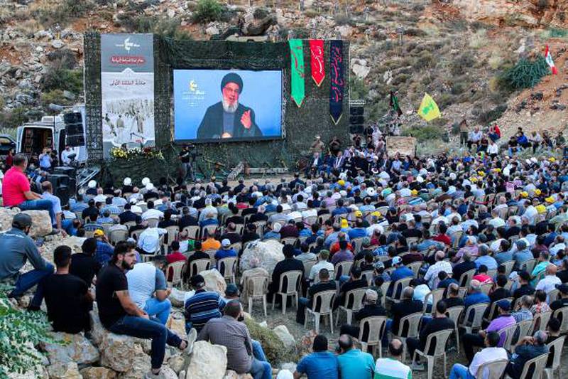 Supporters of Hezbollah attend a televised speech by the group's leader Hassan Nasrallah, in Lebanon on August 19, 2022. AFP/ Getty