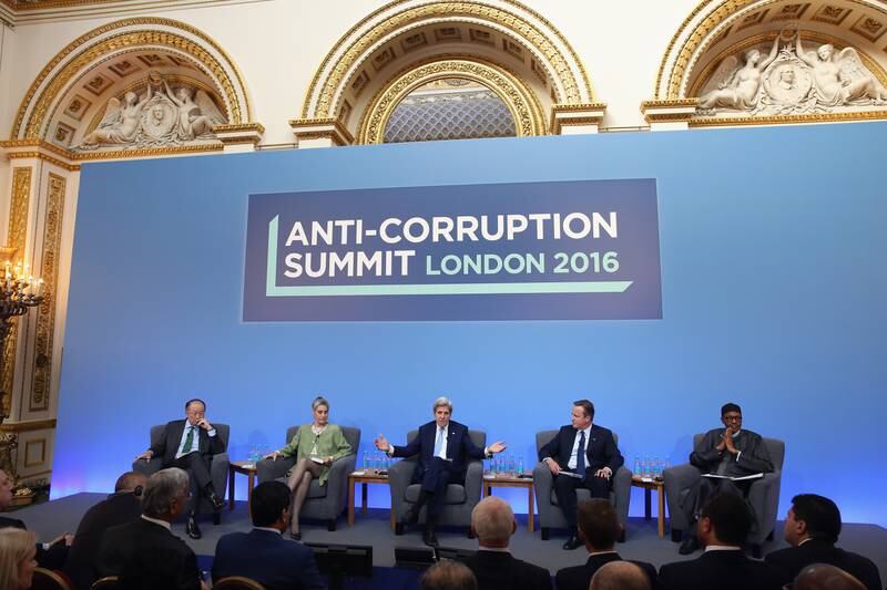 From left to right, attending an international anti-corruption summit in 2016;  Jim Yong Kim, president of the World Bank Group at the time, Sarah Chayes, a senior associate in the Democracy and Rule of Law Program, US secretary of state John Kerry, UK prime minister David Cameron and Nigerian President Muhammadu Buhari.