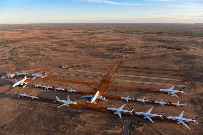ALICE SPRINGS, AUSTRALIA - MAY 15: Grounded aeroplanes which include Airbus A380s, Boeing MAX 8s and other smaller aircrafts are seen at the Asia Pacific Aircraft Storage facility on May 15, 2020 in Alice Springs, Australia. The number of passenger planes housed at the Asia Pacific Aircraft Storage facility has increased due to the Coronavirus (COVID-19) pandemic with at least four Airbus A380 planes grounded there, the first time the aircraft has landed at Alice Springs. (Photo by Steve Strike/Getty Images)