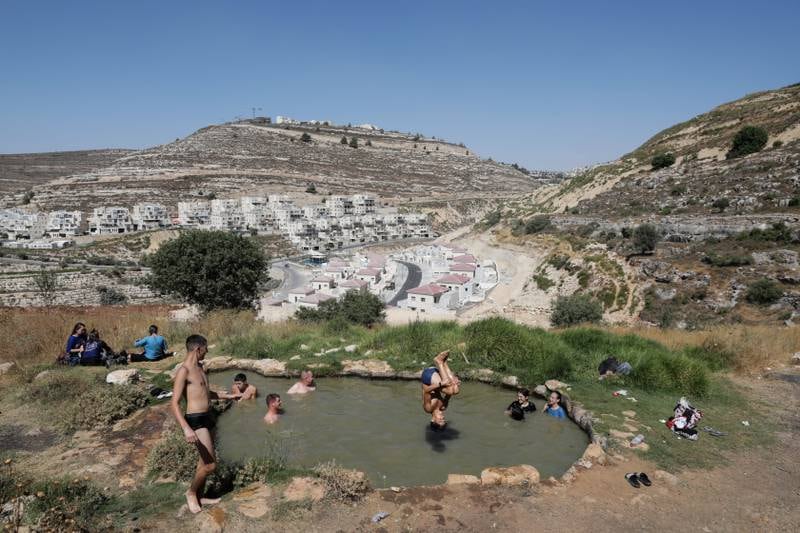 Israelis swim near the Jewish settlement of Givat Ze'ev in the West Bank, north of Jerusalem. EPA