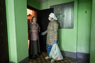Nurse Ivanna Banshchikova visits a woman at home in Moscow.  AFP