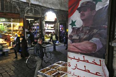 A poster of Syrian President Bashar Al Assad in the Old City of Damascus. AFP