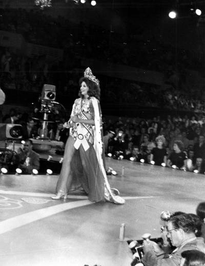 In the Miami Beach Auditorium and Convention Hall, Georgia Risk, Miss Lebanon, takes her first walk as Miss Universe 1971.  Risk was the first woman from her country to be named Miss Universe. Courtesy Miss Universe