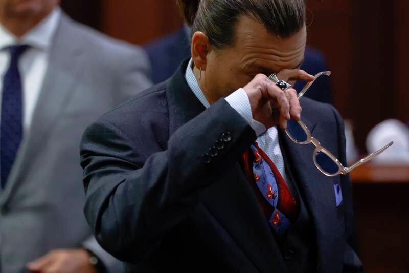 Depp returns to the court after a break in proceedings. EPA