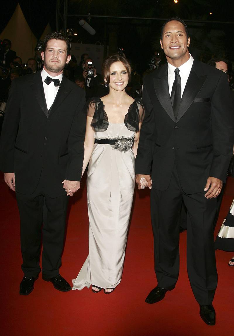 CANNES, FRANCE - MAY 21:  (L-R) US director Richard Kelly, actors Sarah Michelle Gellar and Dwayne Johnson attend the 'Southland Tales' premiere at the Palais during the 59th International Cannes Film Festival May 21, 2006 in Cannes, France.  (Photo by Pascal Le Segretain/Getty Images)