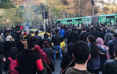 A wave of spontaneous protests over Iran's weak economy swept into Tehran on Saturday, with college students and others chanting against the government. AP