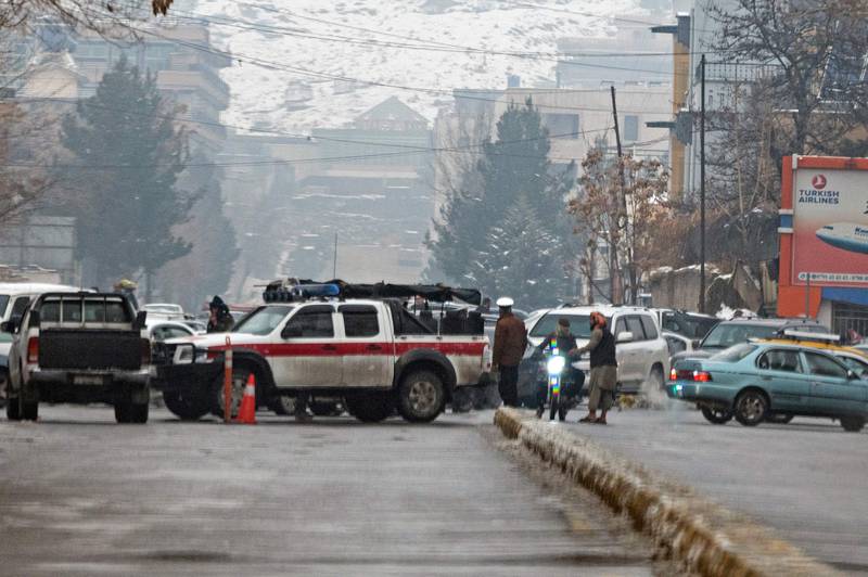 Taliban security forces block a road after a suicide blast near Afghanistan's foreign ministry at the Zanbaq Square in Kabul on January 11, 2023.  - A suicide bomber detonated a device on January 11 near Afghanistan's foreign ministry in the capital, causing more than 20 causalities, an AFP staff member said.  (Photo by Wakil KOHSAR  /  AFP)
