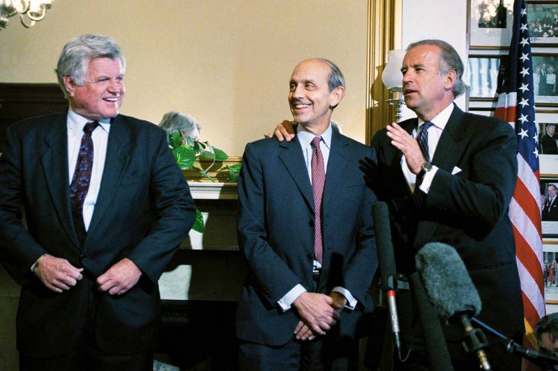 Joe Biden talks to then-president Bill Clinton's Supreme Court nominee Stephen Breyer, as Edward Kennedy looks on. AP