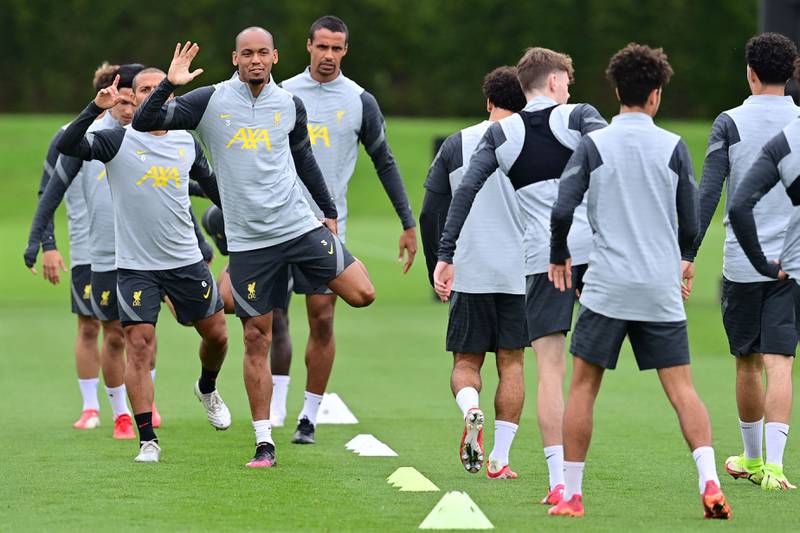 Liverpool's Brazilian midfielder Fabinho giving a wave at training. AFP