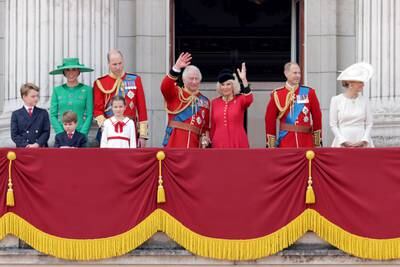 Prince George, Prince Louis, Catherine, Princess of Wales, Princess Charlotte, Prince William, King Charles, Queen Camilla, Prince Edward, and Sophie, Duchess of Edinburgh stand on the balcony of Buckingham Palace to watch a fly-past of aircraft by the Royal Air Force during Trooping the Colour in June 