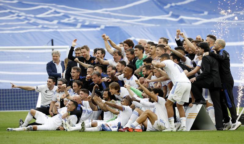 Real Madrid team members celebrate after winning La Liga. Reuters