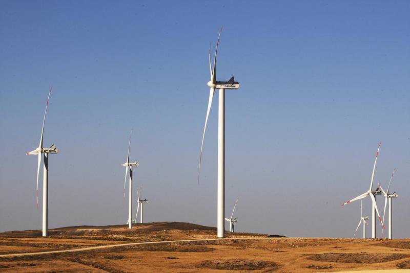 Turbines are seen at the Tafila wind farm in southern Jordan. Masdar on Monday said it reached first financial close on the acquisition of eight renewable projects in the US from EDF Renewables North America. Salah Malkawi / The National