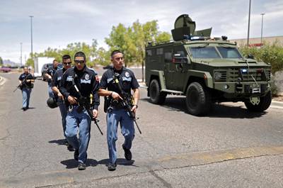 Police stand at attention during an active shooting at a Walmart in El Paso, Texas, USA, 3 August 2019. EPA
