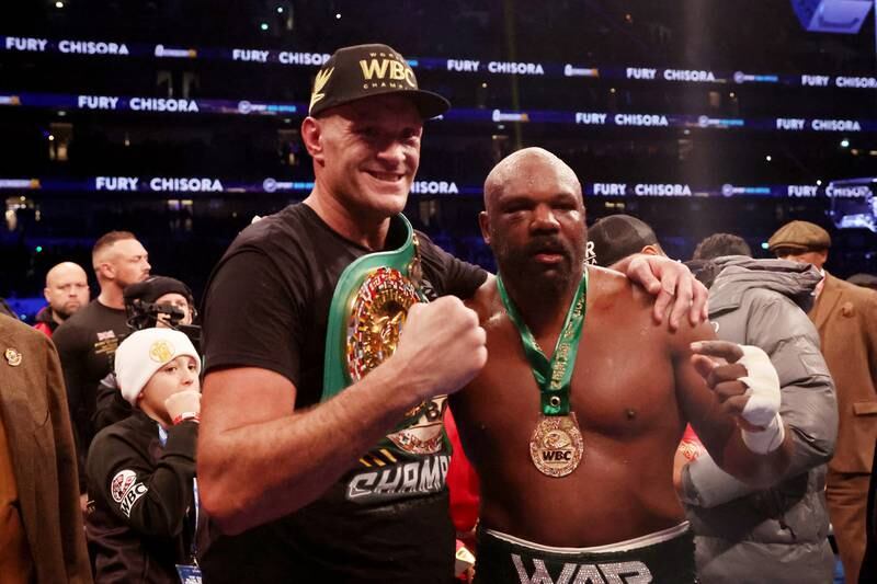 LONDON, ENGLAND - DECEMBER 03: Tyson Fury interacts with  Derek Chisora after victory in the WBC World Heavyweight Title fight between Tyson Fury and Derek Chisora at Tottenham Hotspur Stadium on December 03, 2022 in London, England. (Photo by Warren Little / Getty Images)