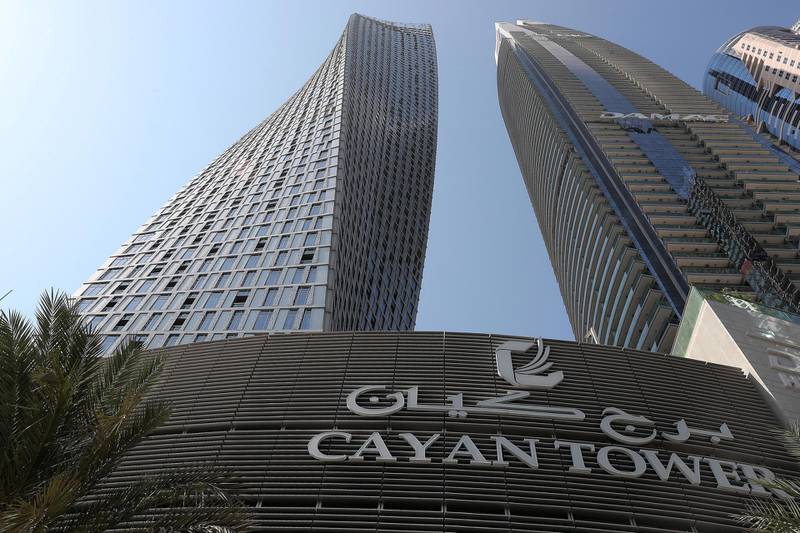 DUBAI , UNITED ARAB EMIRATES , October 28  – 2019 :- Exterior view of the Cayan Tower (left) in Dubai Marina  in Dubai. Lot of residents are facing building issues due to outstanding service charges by landlords.  ( Pawan Singh / The National )  For News. Story by Kelly Clarke