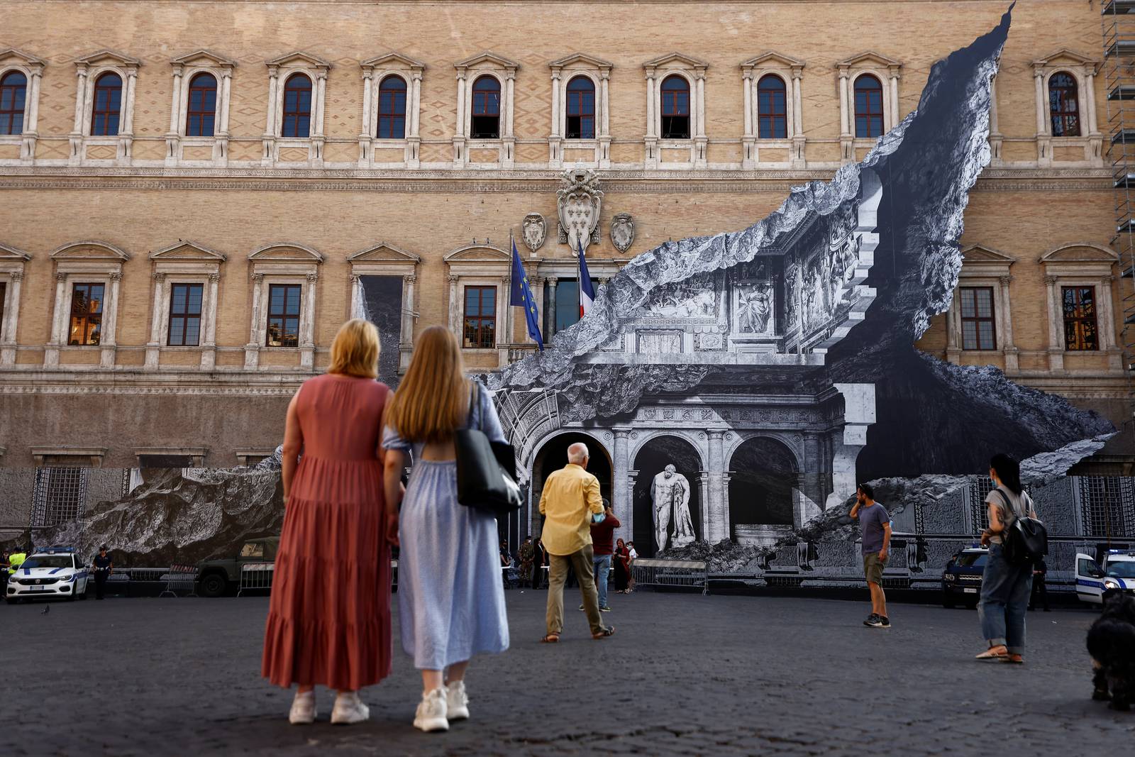 Street artist JR unveils optical illusion artwork in Rome
