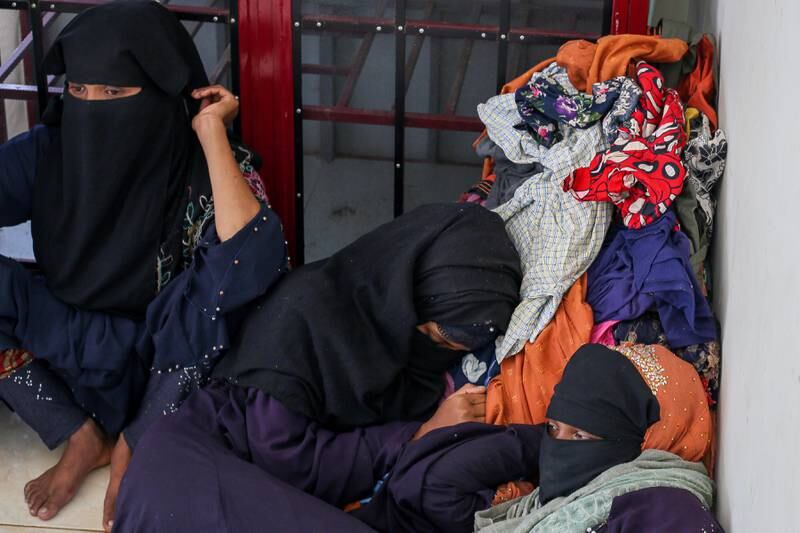 Rohingya refugees rest after being rescued off the coast of Aceh, Indonesia, on March 6. EPA