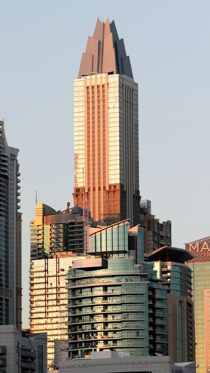 Dubai, United Arab Emirates - November 27th, 2019: Stock. Dubai Marina lit up at sunset. Wednesday, November 27th, 2019. Dubai. Chris Whiteoak / The National