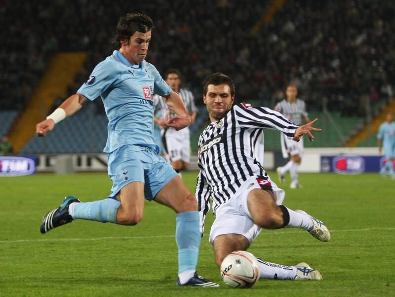 Spurs' Gareth Bale is challenged by Maurizio Domizzi of Udinese during the Uefa Cup match at the Stadio Friuli in October 2008. Getty