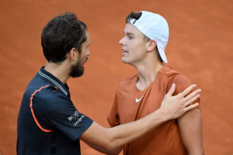 Winner Daniil Medvedev, left, and Denmark's Holger Rune after the final of the Italian Open in Rome on May 21, 2023. AFP