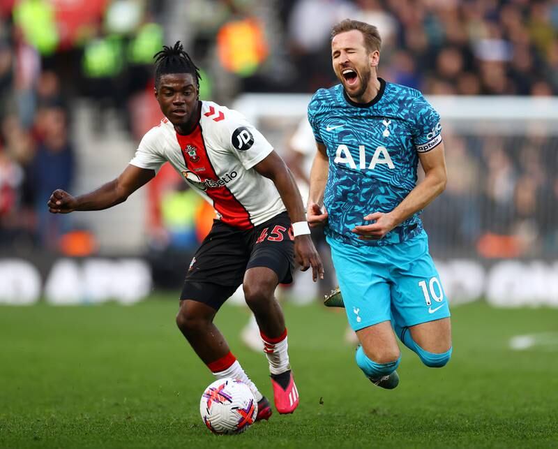Harry Kane is fouled by Romeo Lavia. Getty