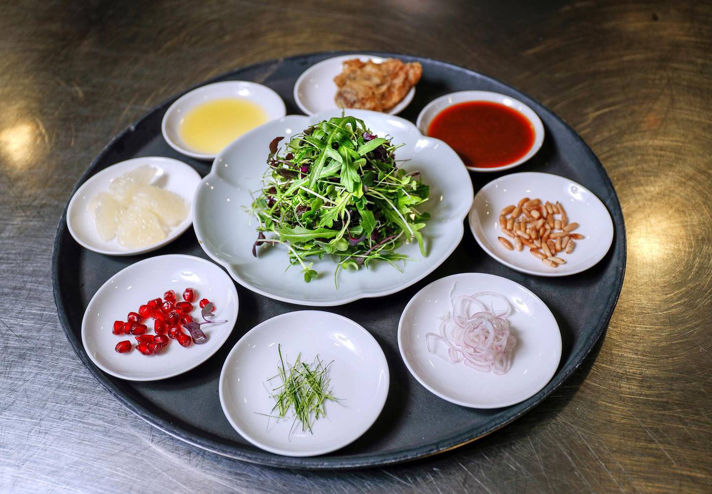 Abu Dhabi, UAE.  March, 12,  2018. Hakkasan Executive Chef, Lee Kok Hua, demonstrates on how to make Crispy Duck Salad.Victor Besa / The NationalWeekendReporter:  Mel Healy