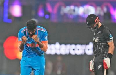 India's Jasprit Bumrah celebrates the wicket of New Zealand's Glenn Phillips, right. AP