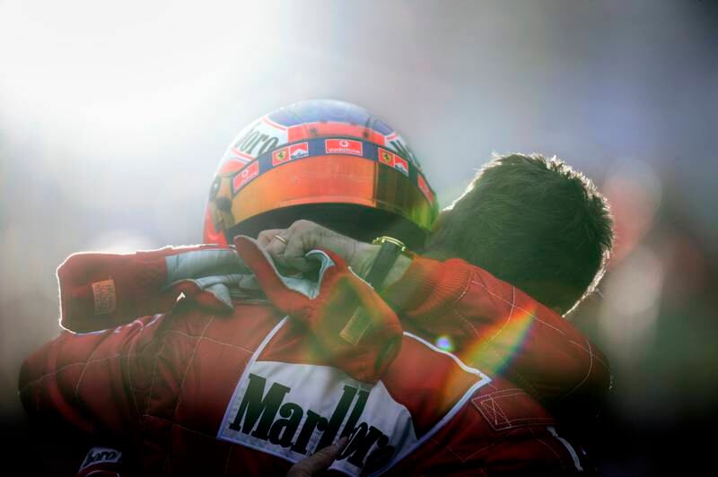 Rubens Barrichello, Michael Schumacher, Grand Prix of Japan, Suzuka Circuit, Suzuka, Japan, October 12, 2003. Rubens Barrichello and Micheal Schumacher, brothers in arms after victory for Rubens and clinching the World Championship for Michael, in Suzuca circuit on the occasion of the 2003 Japanese Grand Prix. Getty Images