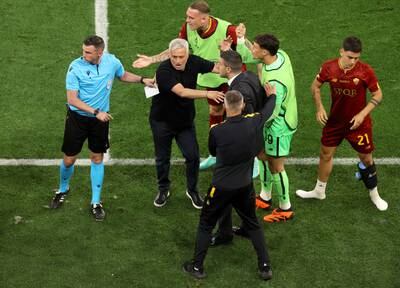 Roma manager Jose Mourinho confronts fourth official Michael Oliver after referee Anthony Taylor awarded a penalty to Sevilla that was later overturned following a VAR check. Getty
